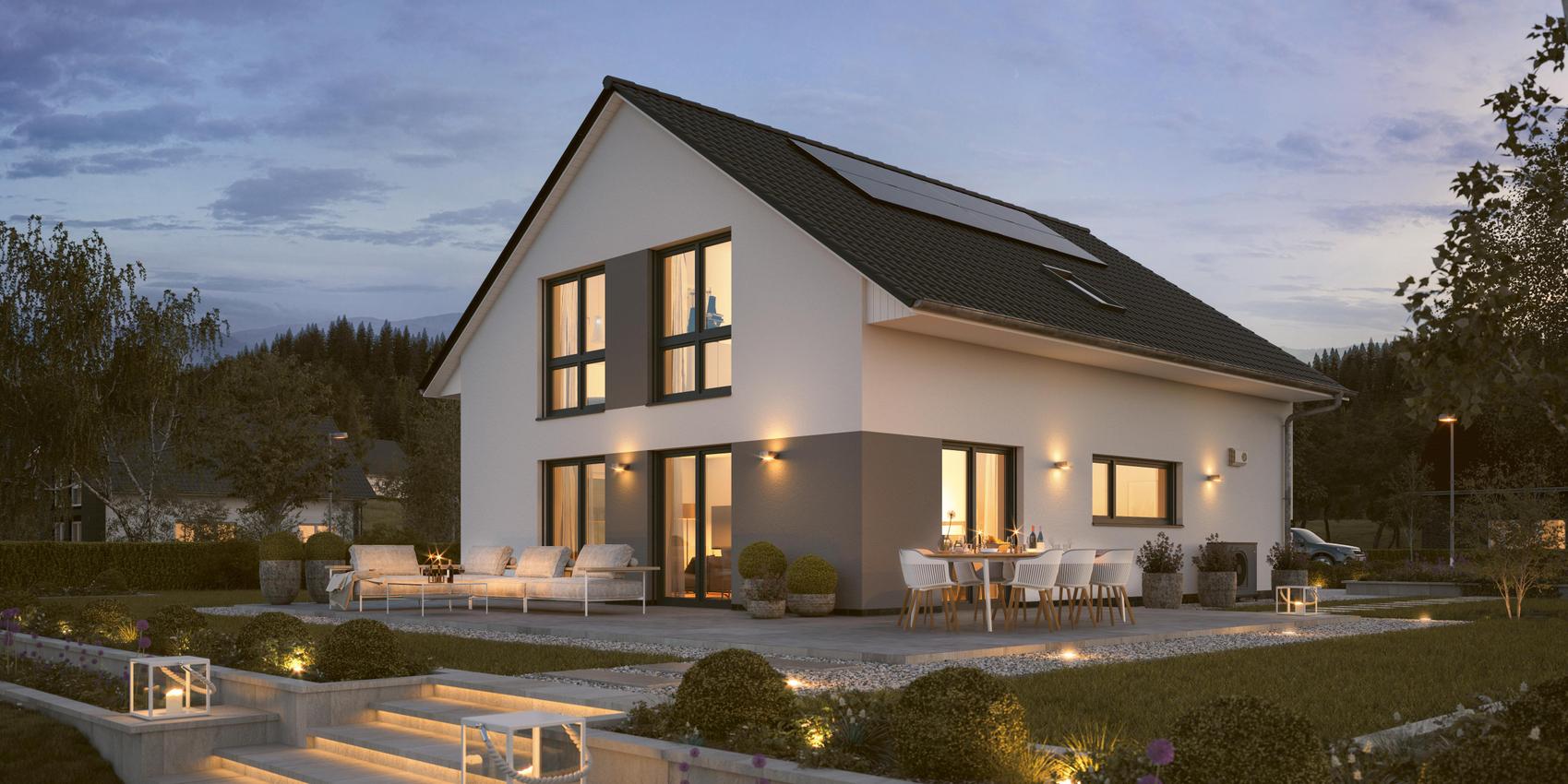 Ansicht auf ein Einfamilienhaus weiß und grau verputzt mit Terrasse aus dem Garten. Hierbei handelt es sich um das Maxime 420 von Viebrockhaus