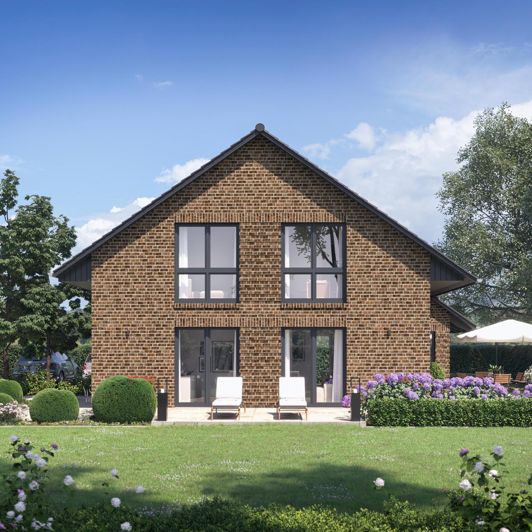 Einfamilienhaus mit großer Fensterfront zum Garten.