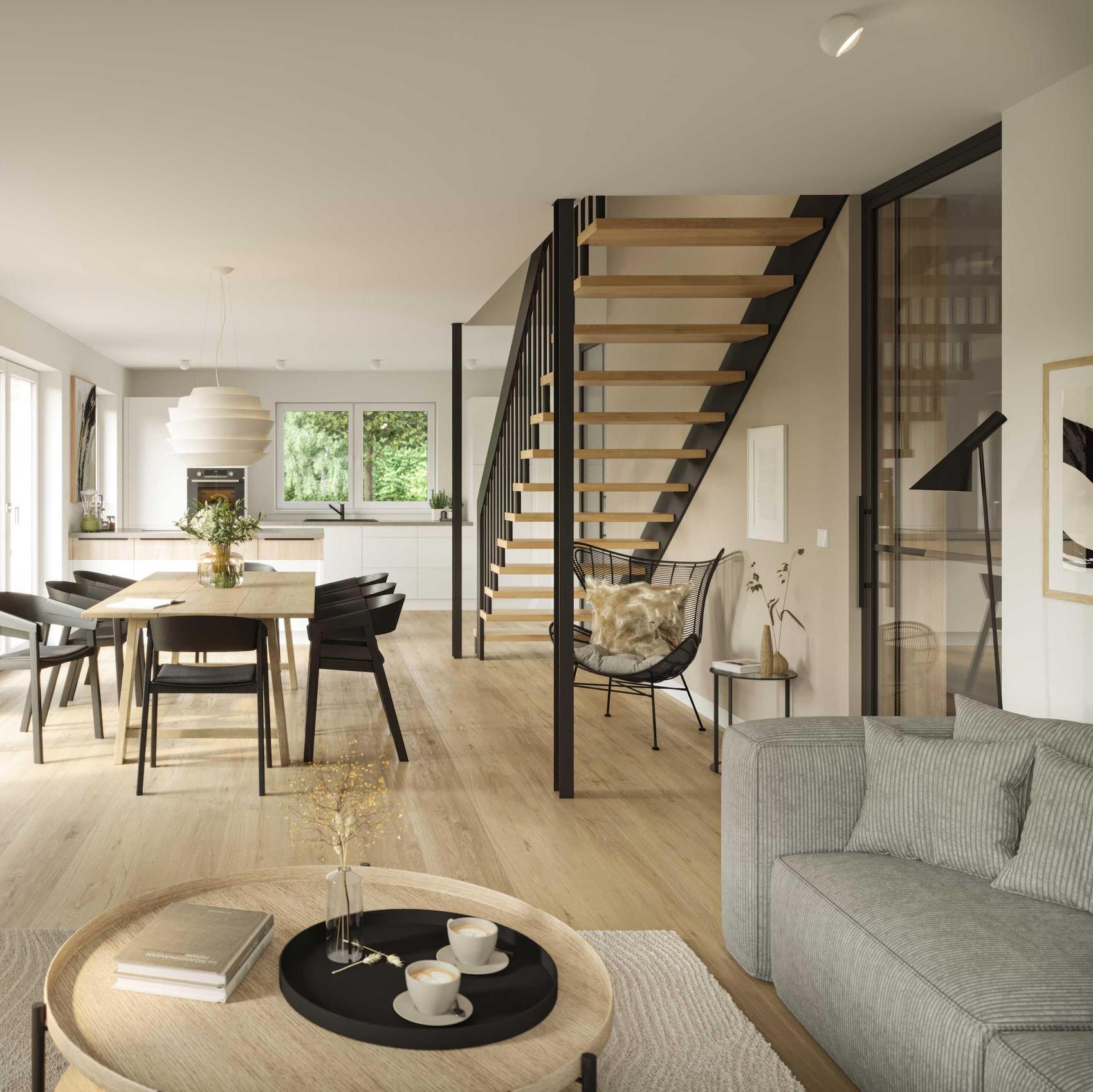 Blick vom Wohnbereich über den Essbereich mit Treppenaufgang bis zur offenen Küche eines Viebrockhauses