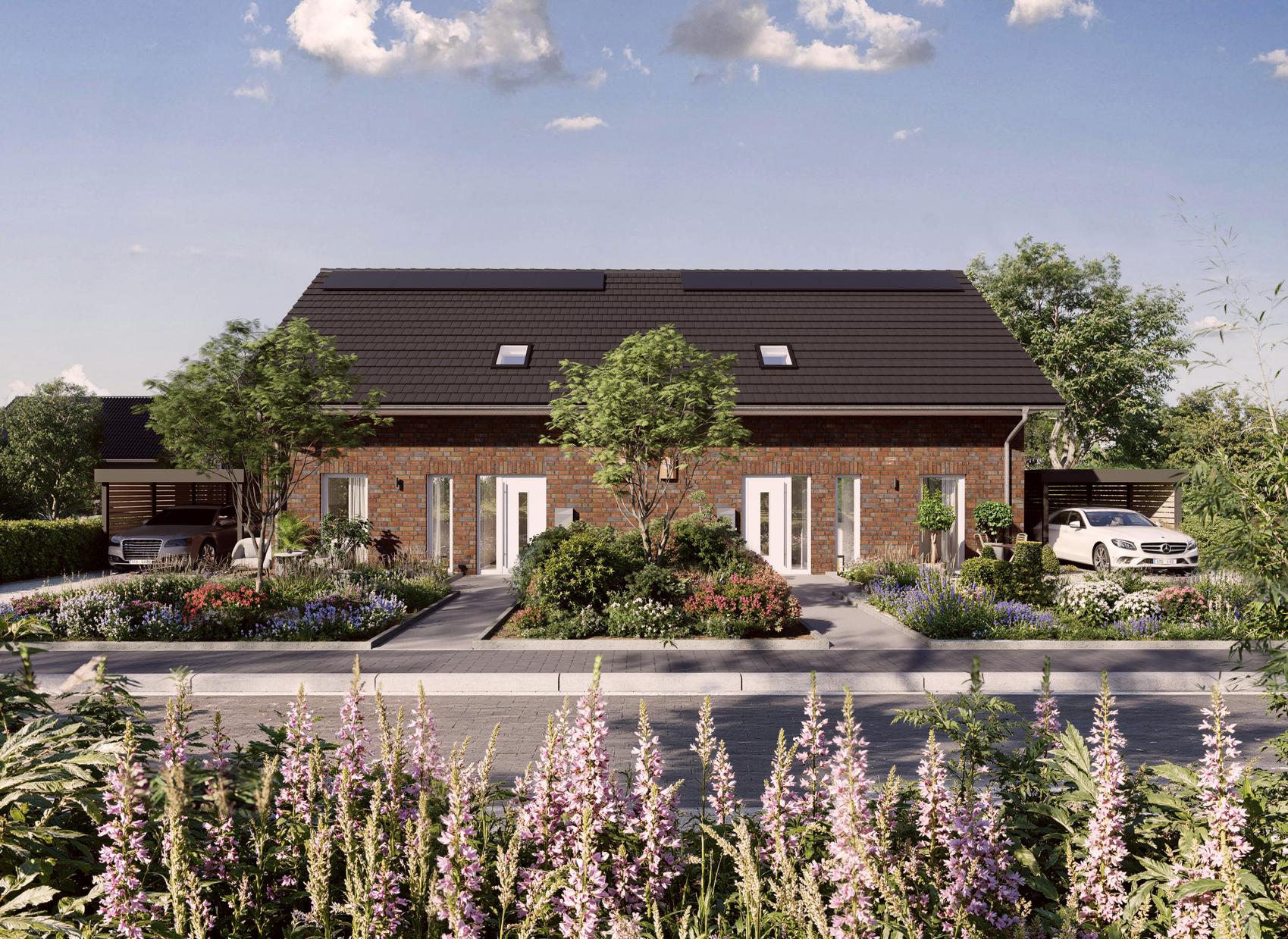 Doppelhaus von Viebrockhaus mit Blumenbeet im Vordergrund