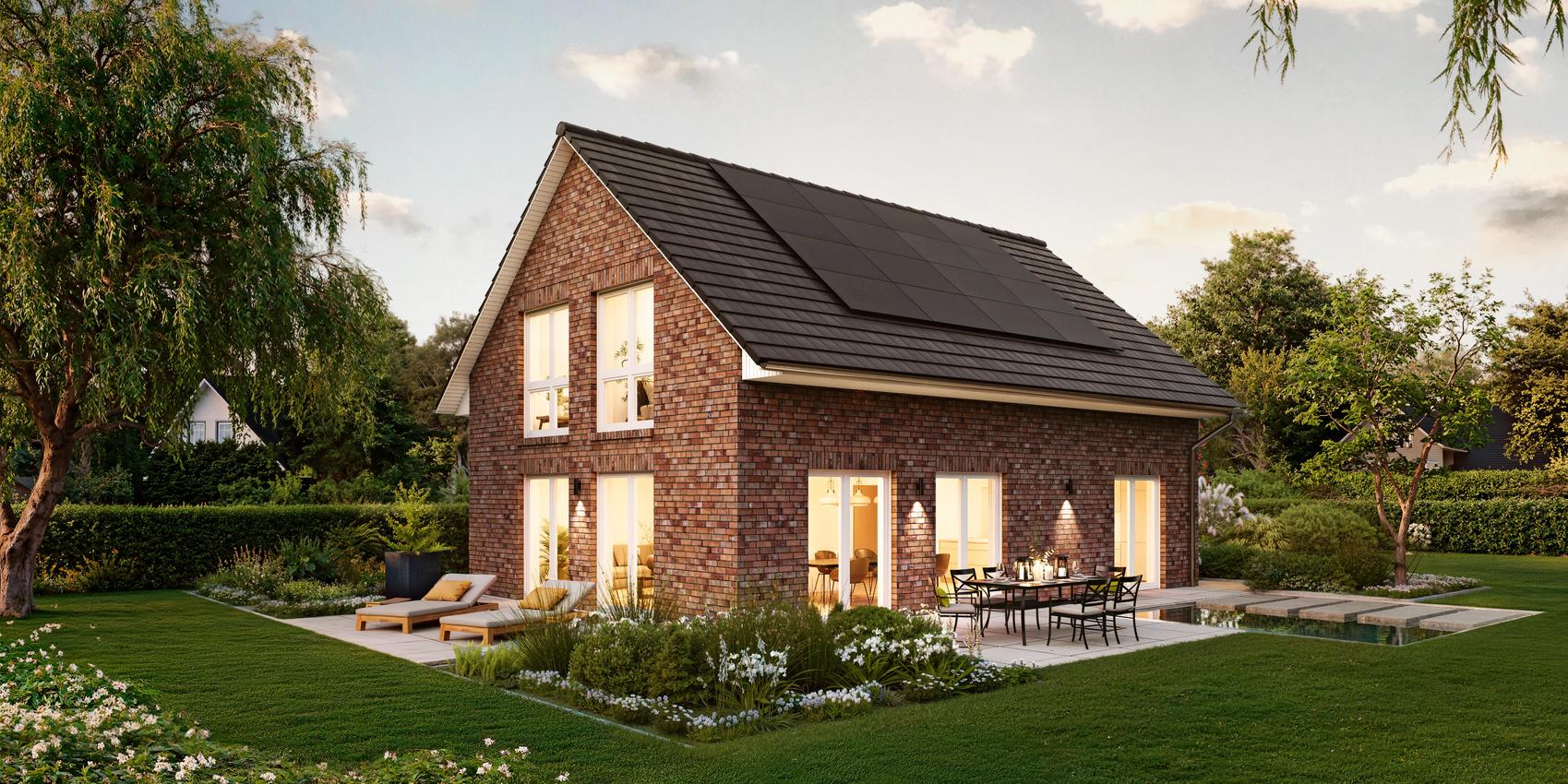 Seitenansicht eines Einfamilienhauses mit grauen Klinkersteinen. Das Einfamilienhaus ist das V1 von Viebrockhaus