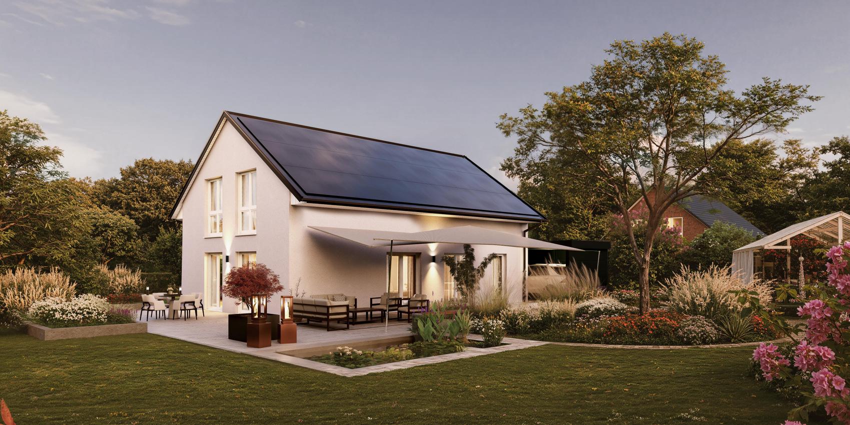 Gartenansicht eines Einfamilienhauses mit Putz und einem großen Power Roof auf dem Dach. Es handelt sich um das V2 Limited von Viebrockhaus