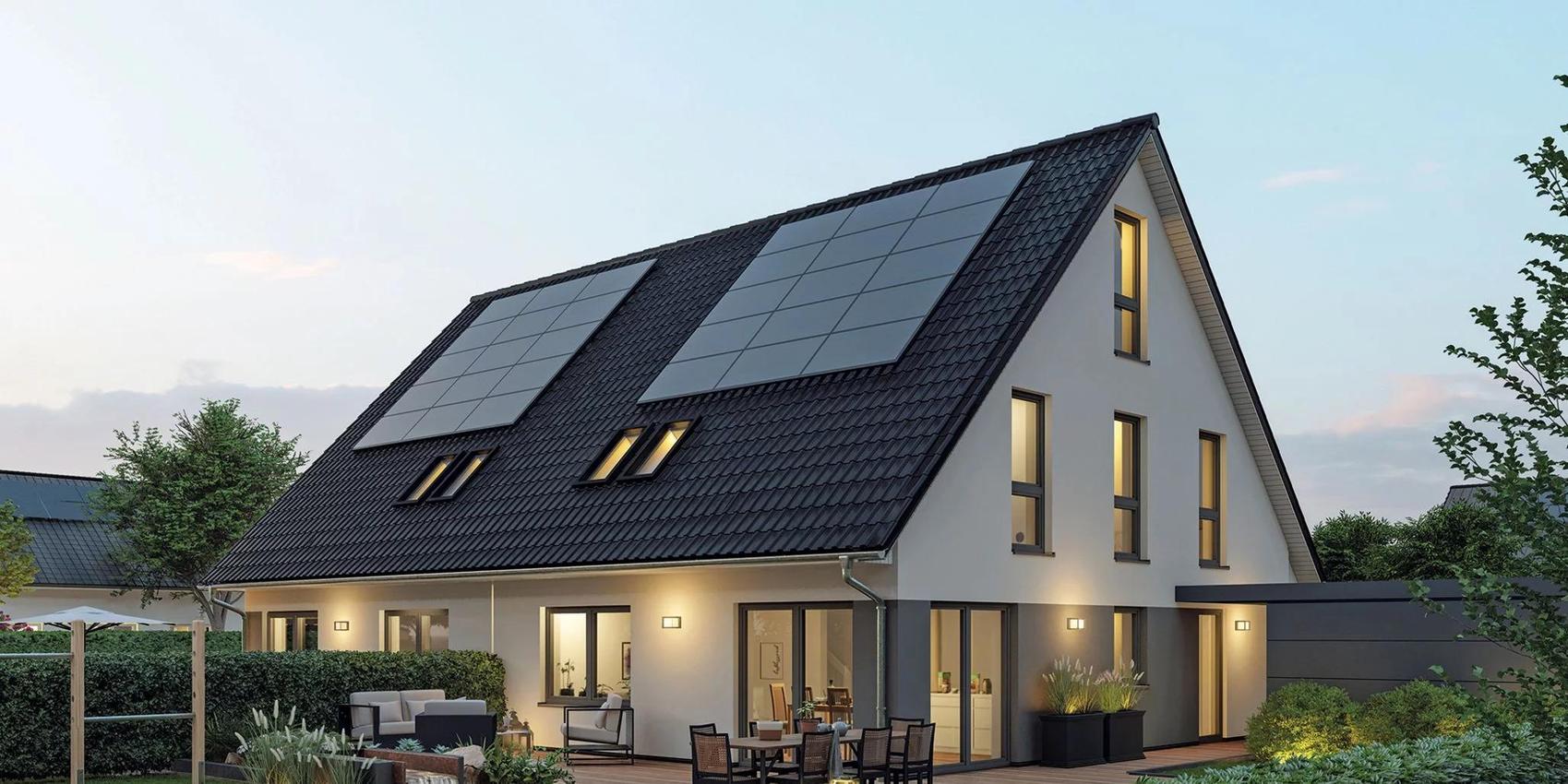 Massivhaus von Viebrockhaus als Doppelhaus in der Dämmerung, welches in Cottbus gebaut werden kann