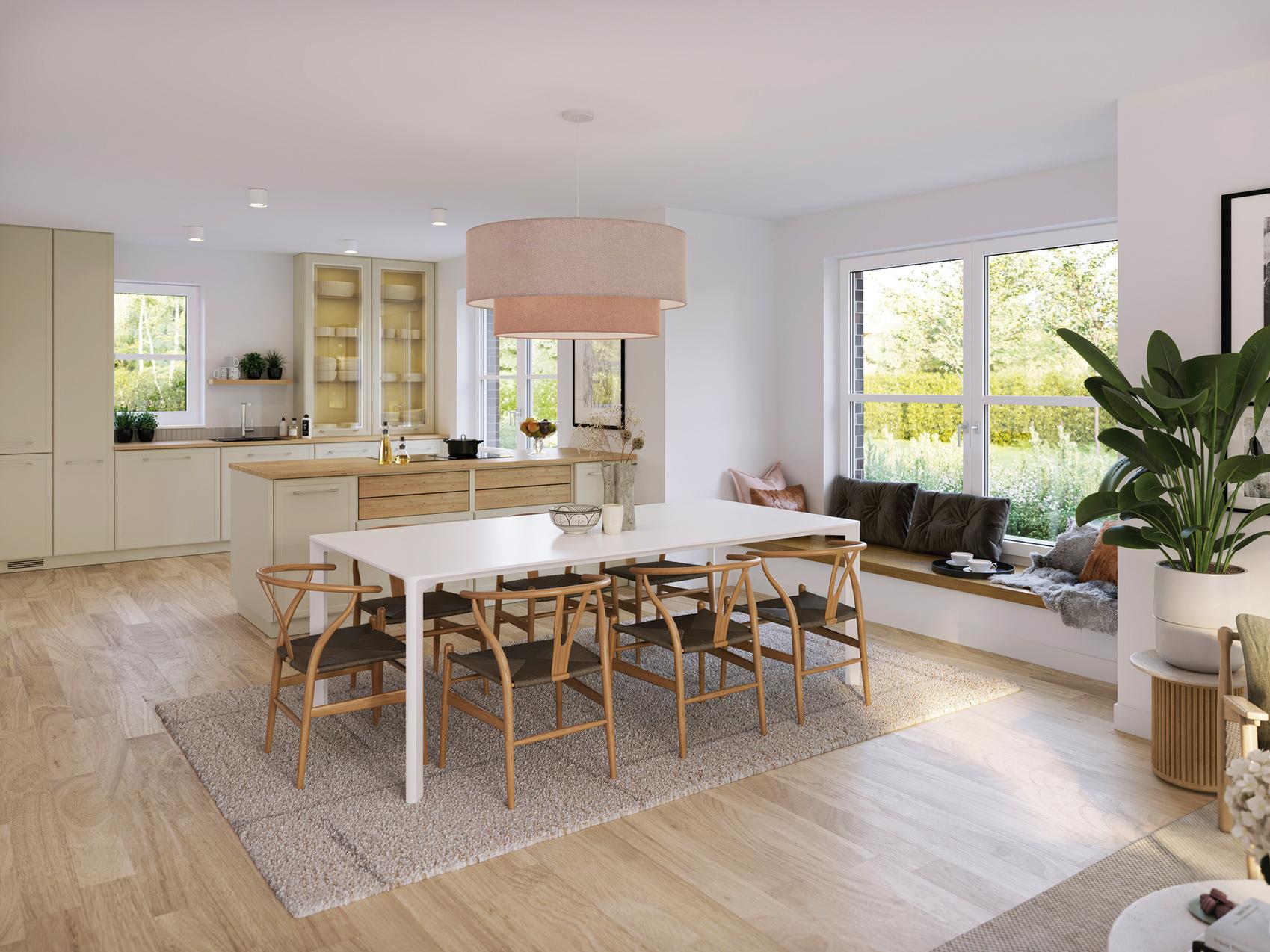  Blick in eine helle moderne Küche mit Essbereich