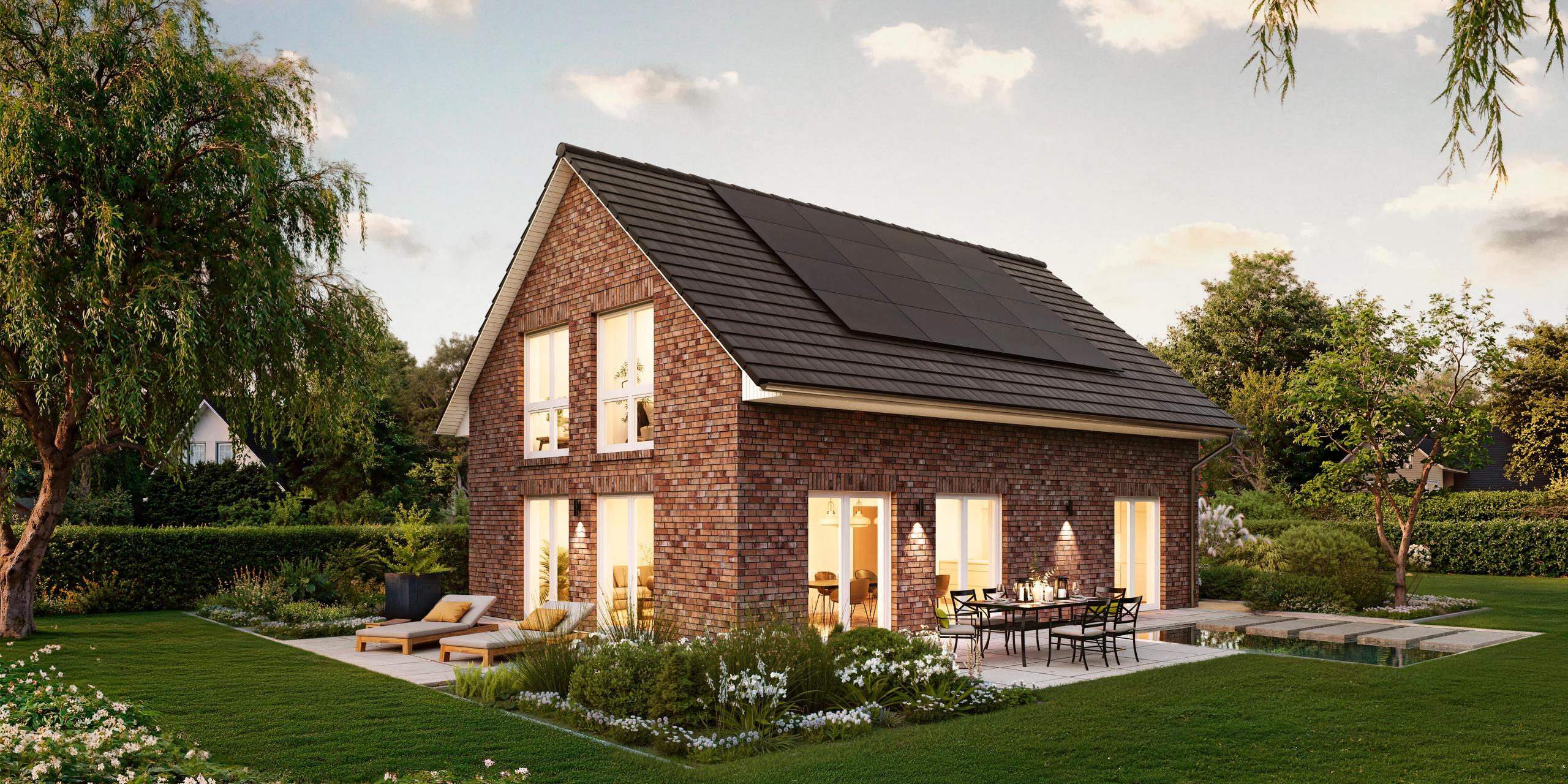 Seitenansicht eines Einfamilienhauses mit grauen Klinkersteinen. Das Einfamilienhaus ist das V1 von Viebrockhaus